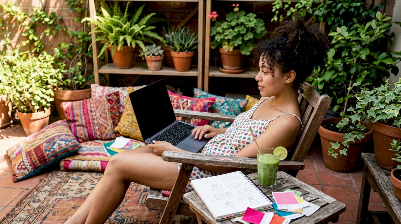 Woman browsing swimwear collections online at home